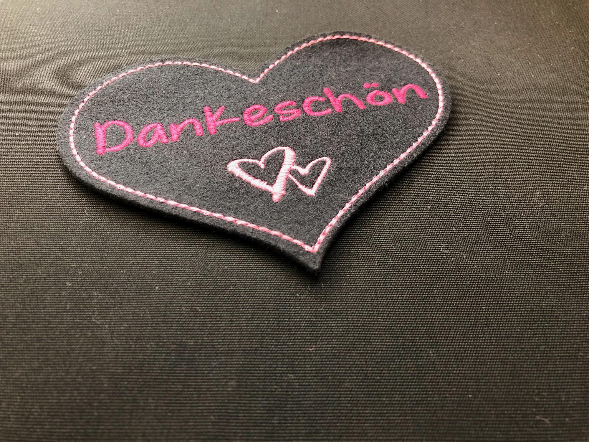 two embroidered patches on canvas