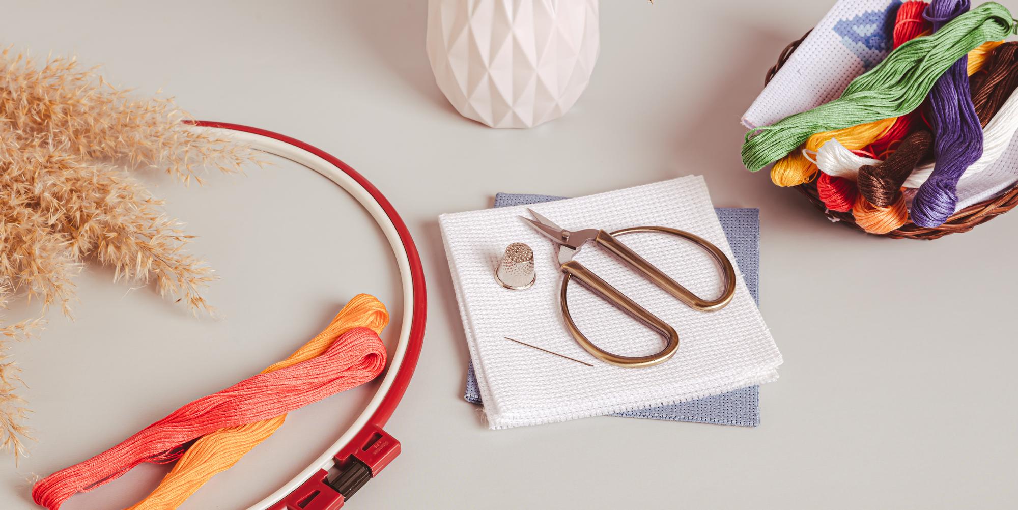 flatlay of embroidered goods and tools